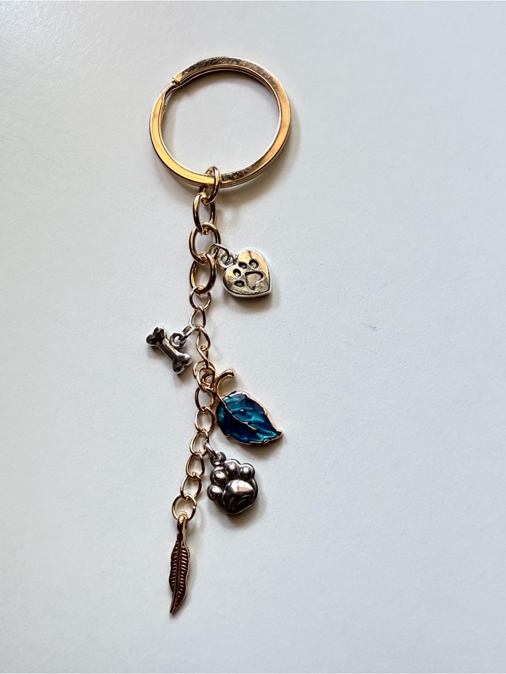 Gold Tone Paw & Blue Leaf Charm Keychain